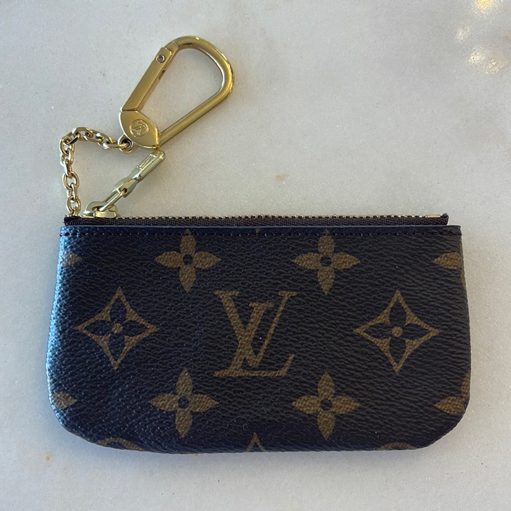 - Real Louis Vuitton key/card pouch.